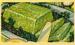 an illustration of a green gelatin salad with carrots from a 1950s cookbook