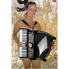 a woman playing an accordion; the woman is naked