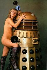 Katy Manning posing nude with a Dalek