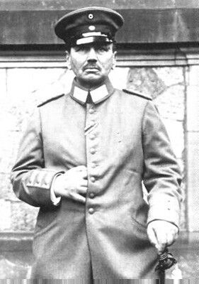 a German (Prussian?) military officer with his fingers threaded between the buttons of his coat