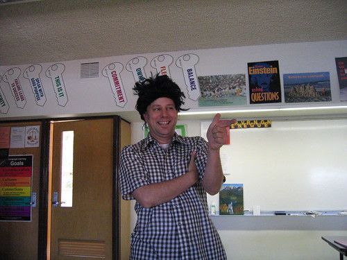 the author wearing a bad wig in an American high school classroom