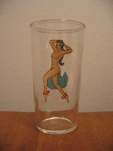 the same glass but turned so that the woman is seen through the glass; on the inside, she's naked