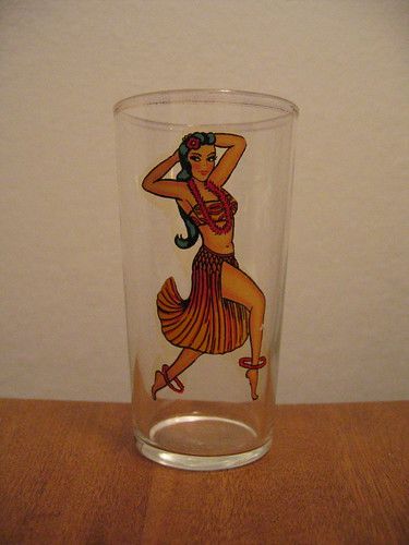 a drinking glass with an image of a dancing Hawai'ian (?) woman