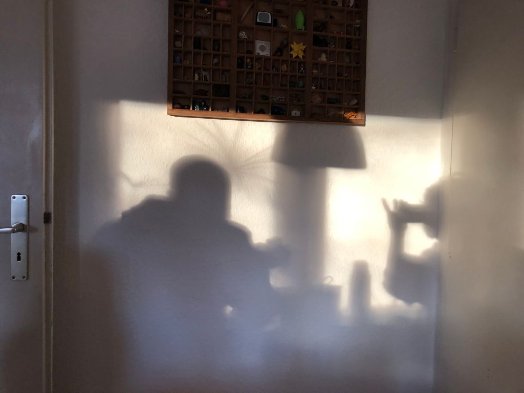 a shadow of a person and the person taking the picture
