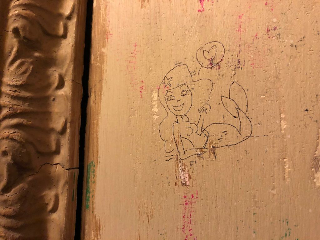 ball point pen graffiti of a mermaid speaking love
